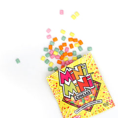 THE HAMPTON CANDY COMPANY mini chiclet next to coin showing compact size