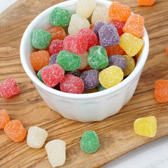 THE HAMPTON CANDY COMPANY held in hand to show scale and portioning convenience benefit