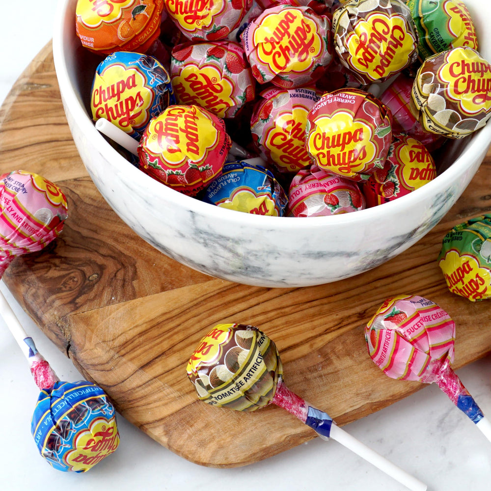THE HAMPTON CANDY COMPANY bag beside ruler for scale showing approx 64 lollipops