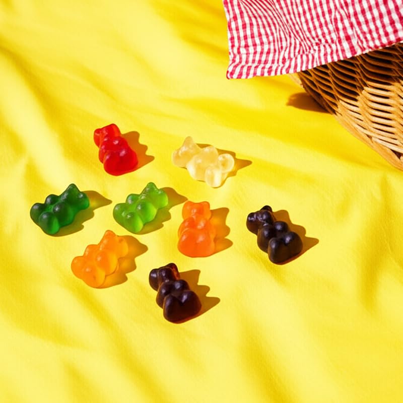 THE HAMPTON CANDY COMPANY gummy bears beside coin for scale, demonstrates bite-sized servings
