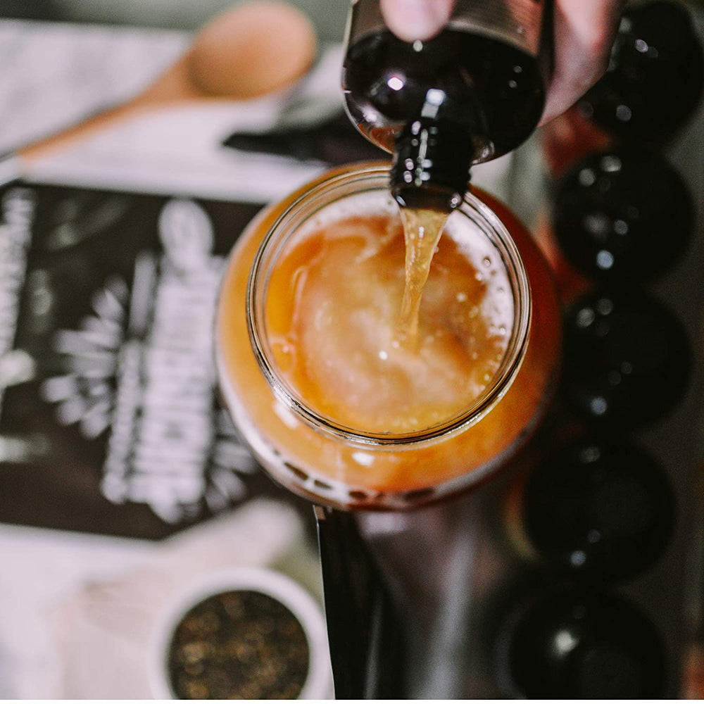 The Kombucha Company label close-up showing ingredients and transparent sourcing benefit