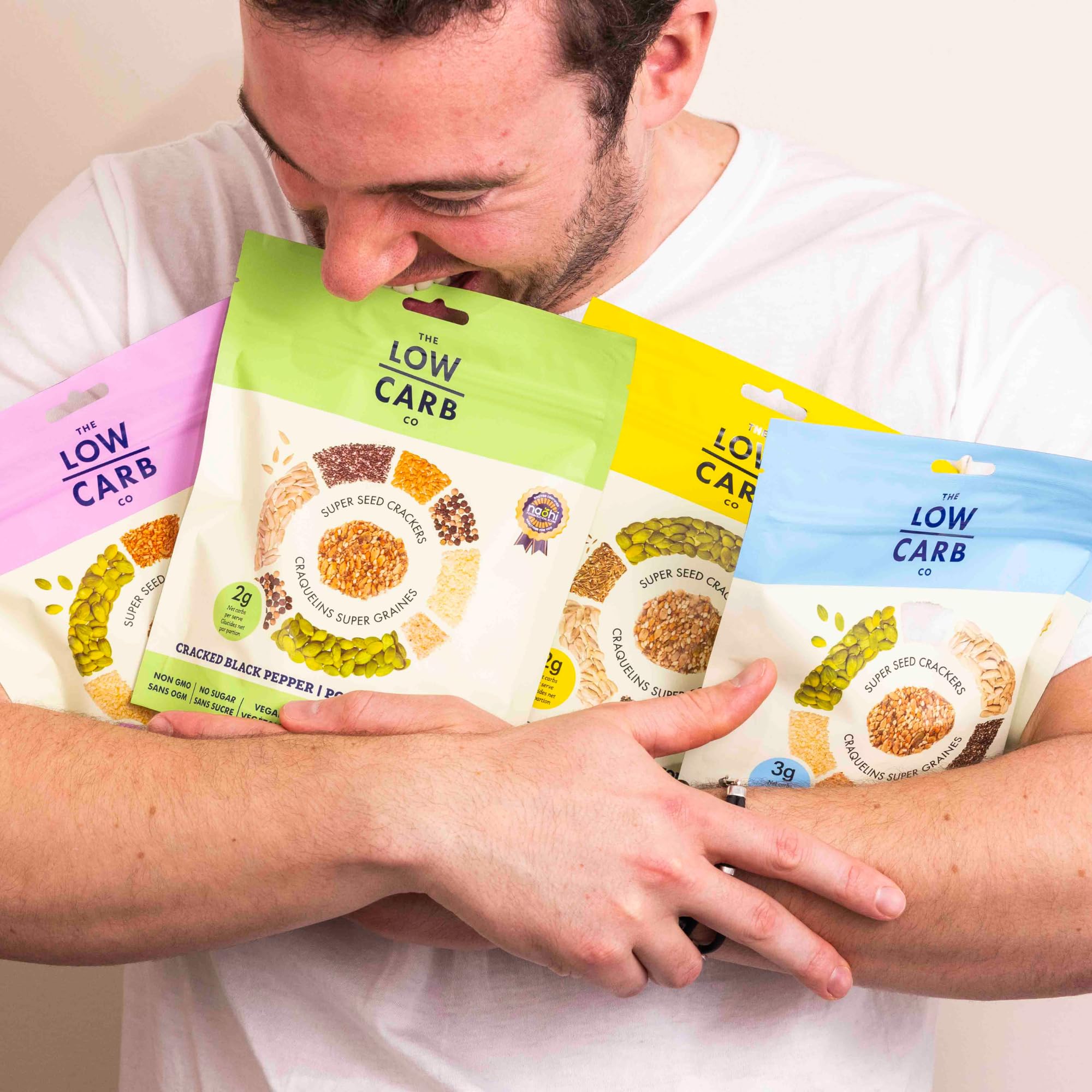 The Low Carb Co crackers being dipped showing versatile serving options