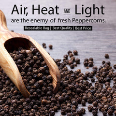 Freshly ground pepper falling from a grinder with THE ORGANIC PANTRY peppercorns for stronger flavor