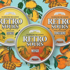 The Penny Candy Store front-view tins showing three fruity sour flavors and easy sharing