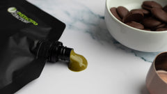 The Pistachio Factory spoon close-up highlights fine grind and smoothness benefit