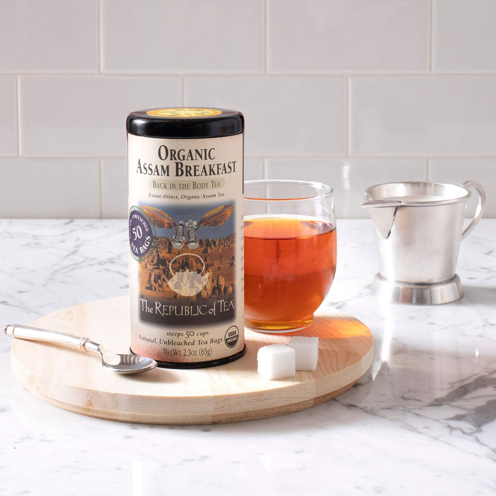 Brewed cup of The Republic of Tea Assam with amber color, demonstrating robust malty flavor