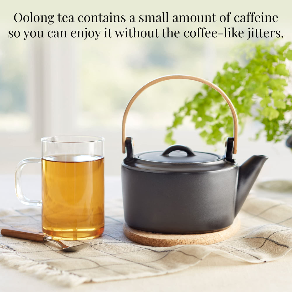 Glass infuser steeping The Republic of Tea sachet releasing peach fragrance and smooth flavor