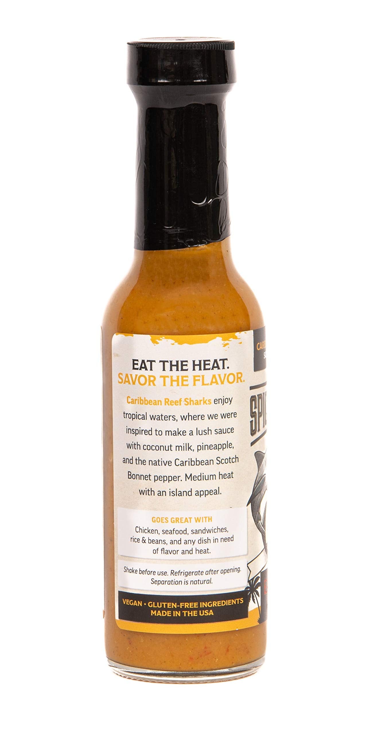 Close-up pour of Caribbean Reef Shark sauce highlighting creamy texture and balanced heat