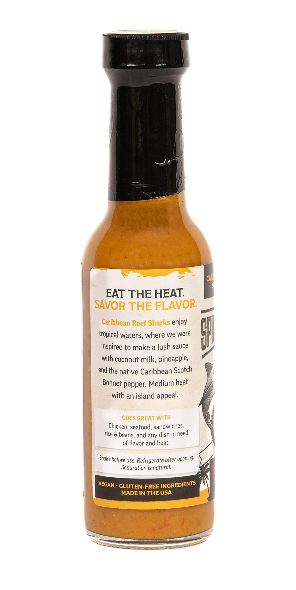 Close-up pour of Caribbean Reef Shark sauce highlighting creamy texture and balanced heat