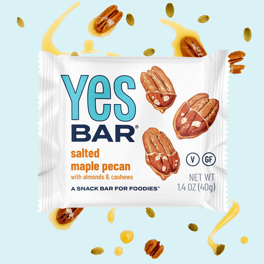 The YES Bar ingredients spread featuring almonds cashews macadamia seeds for wholesome fuel