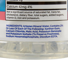Thick-It bottle beside a drinking glass demonstrating serving scale