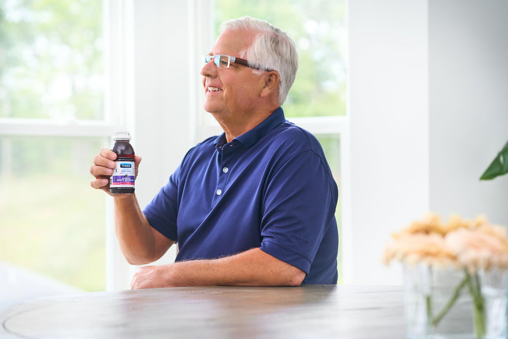 Thick-It bottle by bedside in care setting emphasizing quick hydration access