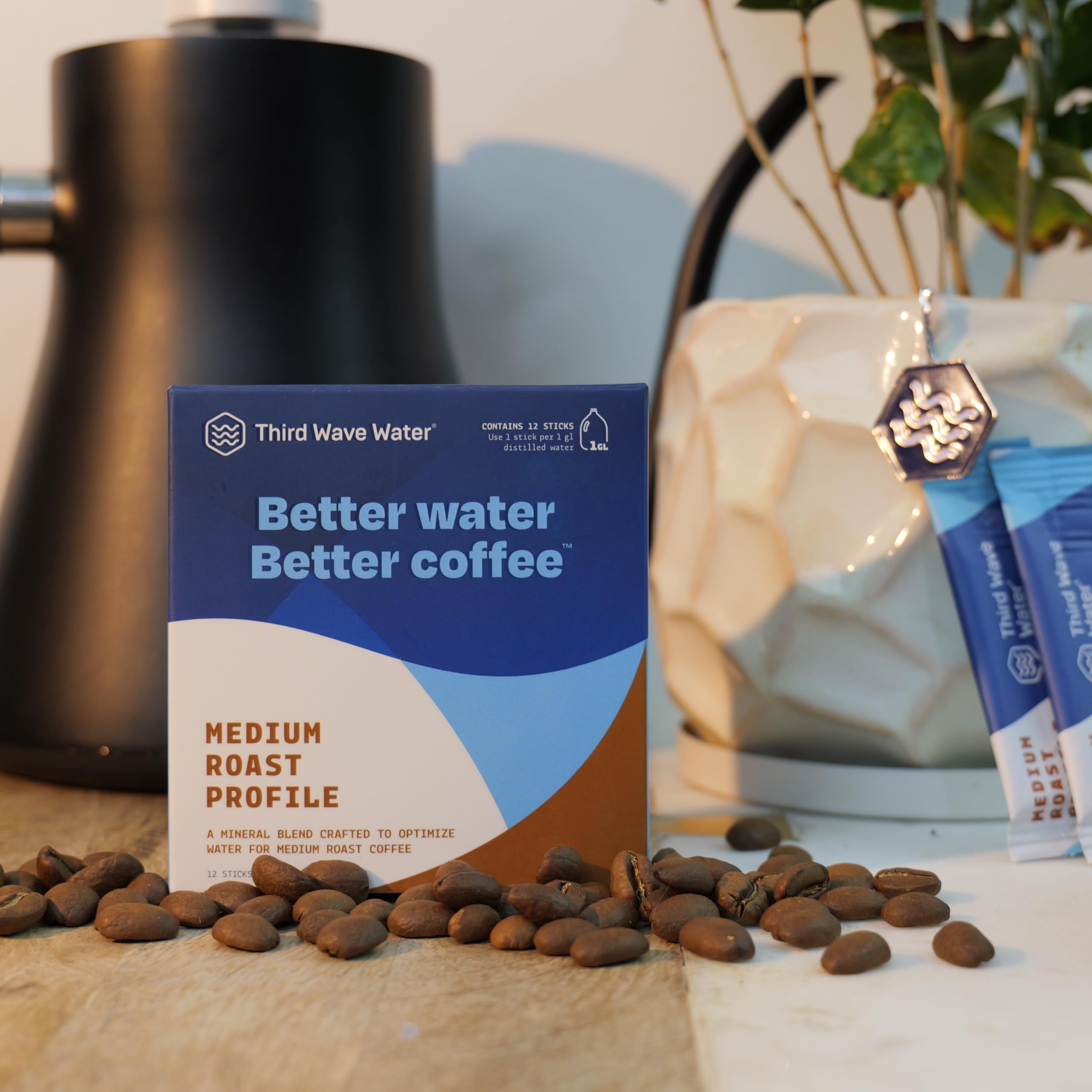 Third Wave Water stick beside a coffee bag to show scale and convenience for home brewing routines