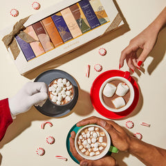 Thoughtfully pouring hot chocolate into a mug demonstrating smooth, rich consistency