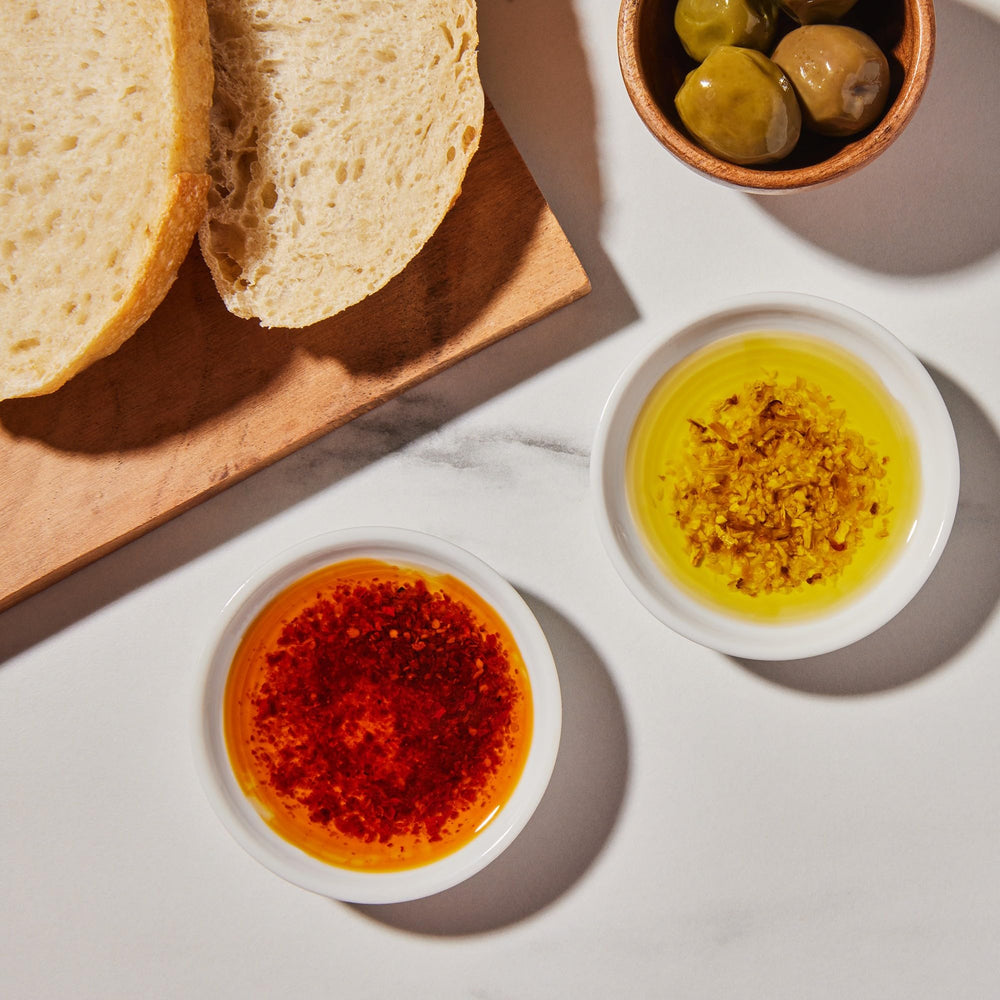 Thoughtfully Tuscan oil served with bread for dipping to enhance simple appetizers