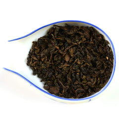 TIAN HU SHAN steeped tea in cup demonstrating mellow color and smooth mouthfeel