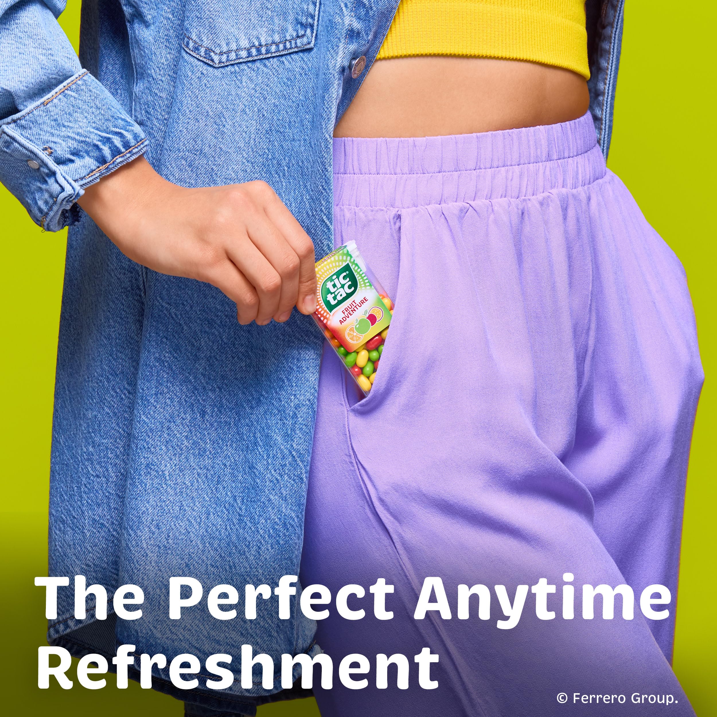 Hand holding a Tic Tac bottle to show scale and pocket-friendly size