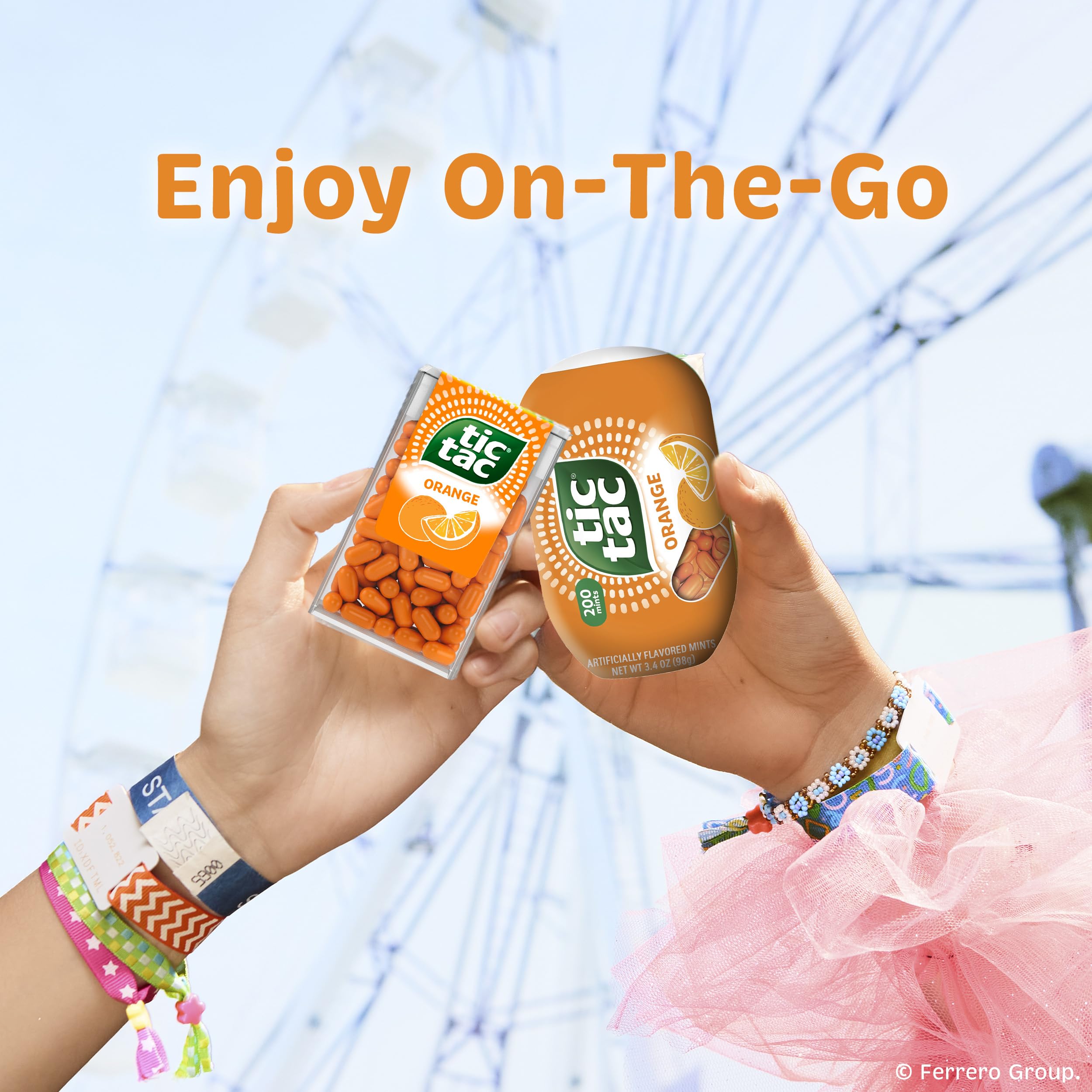 Tic Tac being poured into a hand from the small dispenser for quick on-the-go refreshment