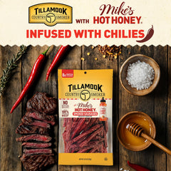 Tillamook Country Smoker sliced on charcuterie board paired with cheese and crackers for sharing