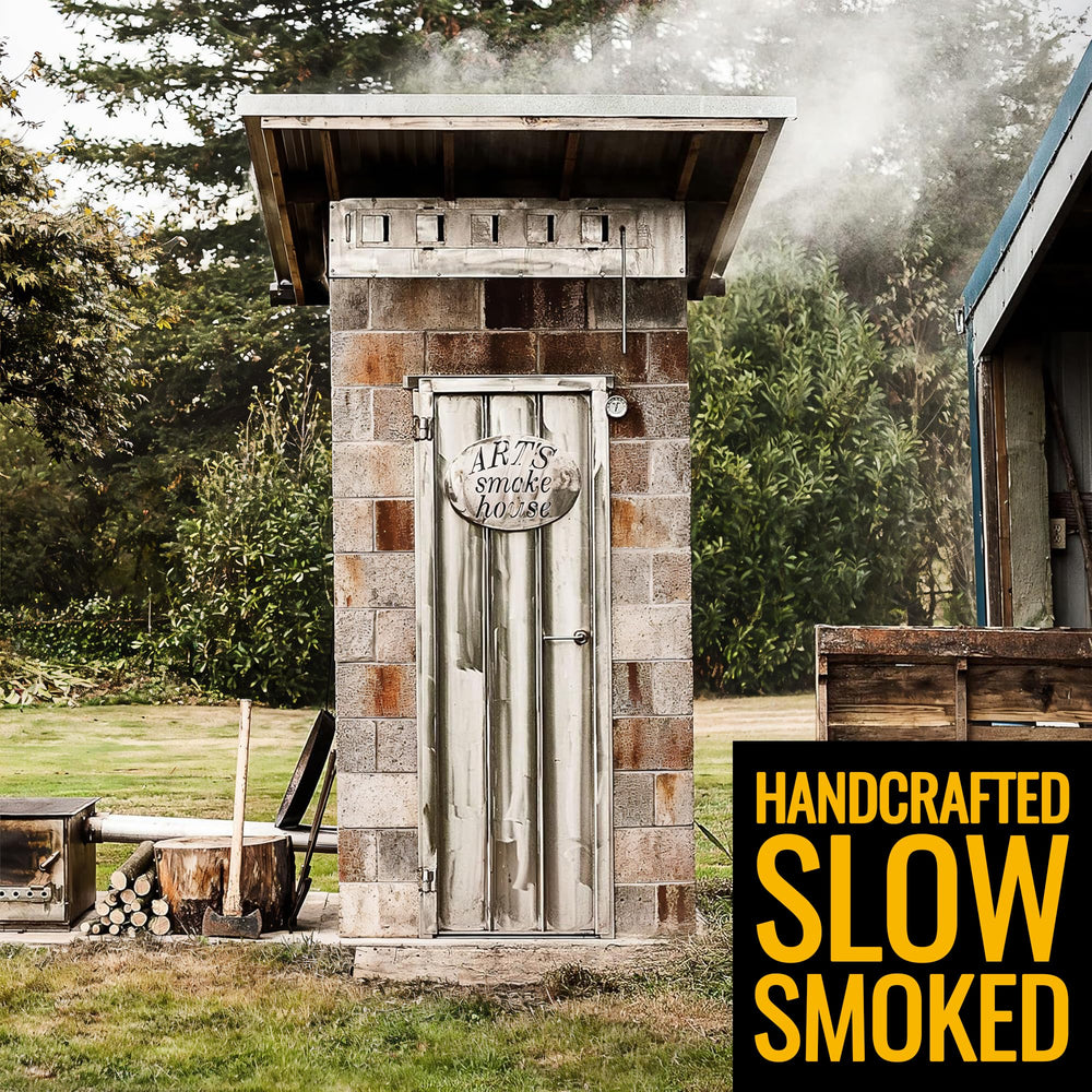 Tillamook Country Smoker stick held in hand to show 1-ounce portable serving