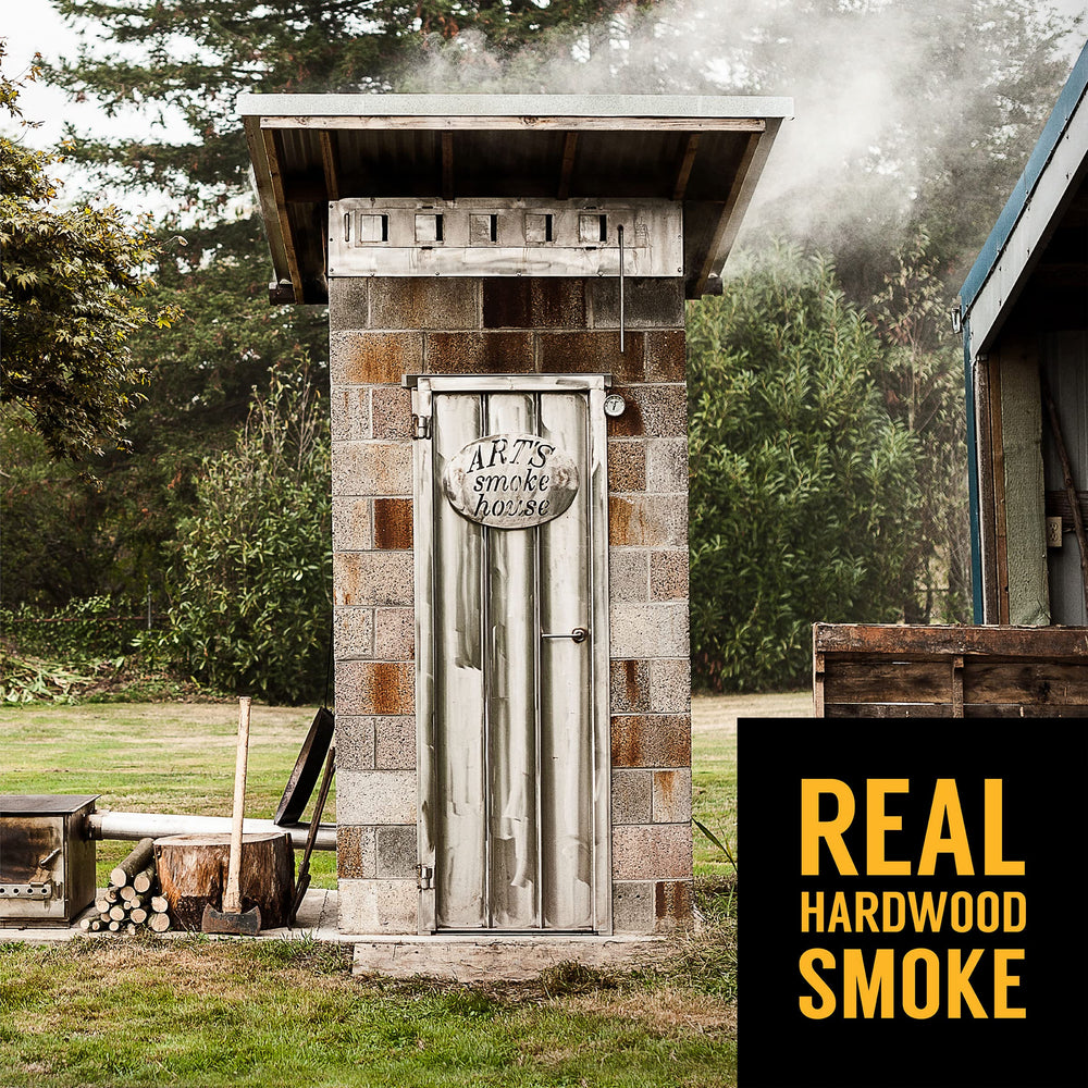 Tillamook Country Smoker sausage held in hand to show size and portion-friendly serving