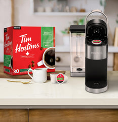 Tim Hortons decaf K-Cup pod close-up showing filter top and sealed rim for freshness benefit
