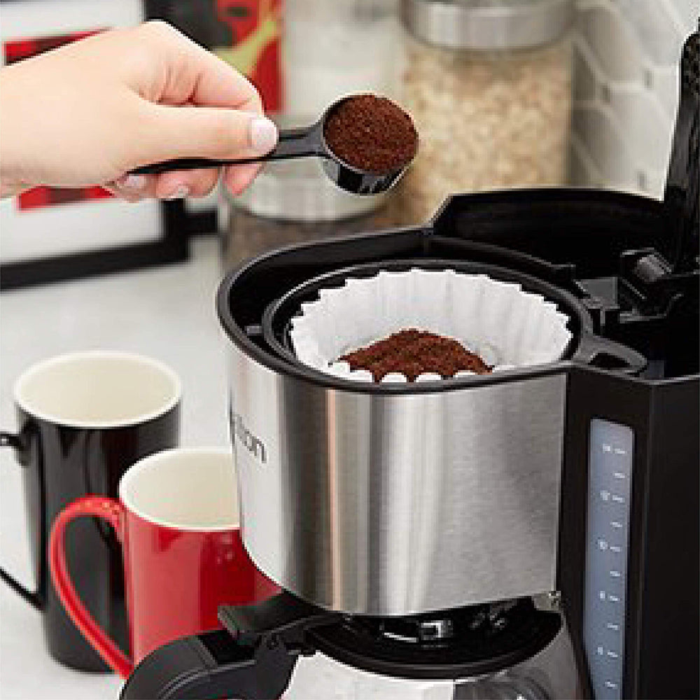 Tim Hortons grounds pouring into a filter illustrating clean drip brewing
