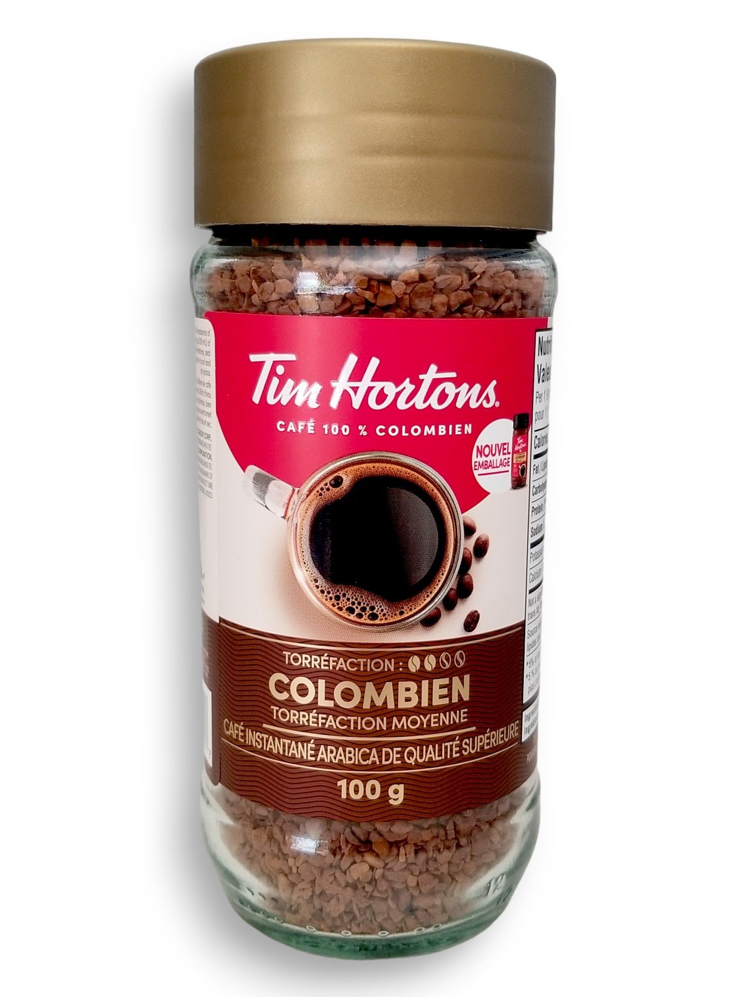 pouring Tim Hortons instant coffee into cup illustrating quick preparation