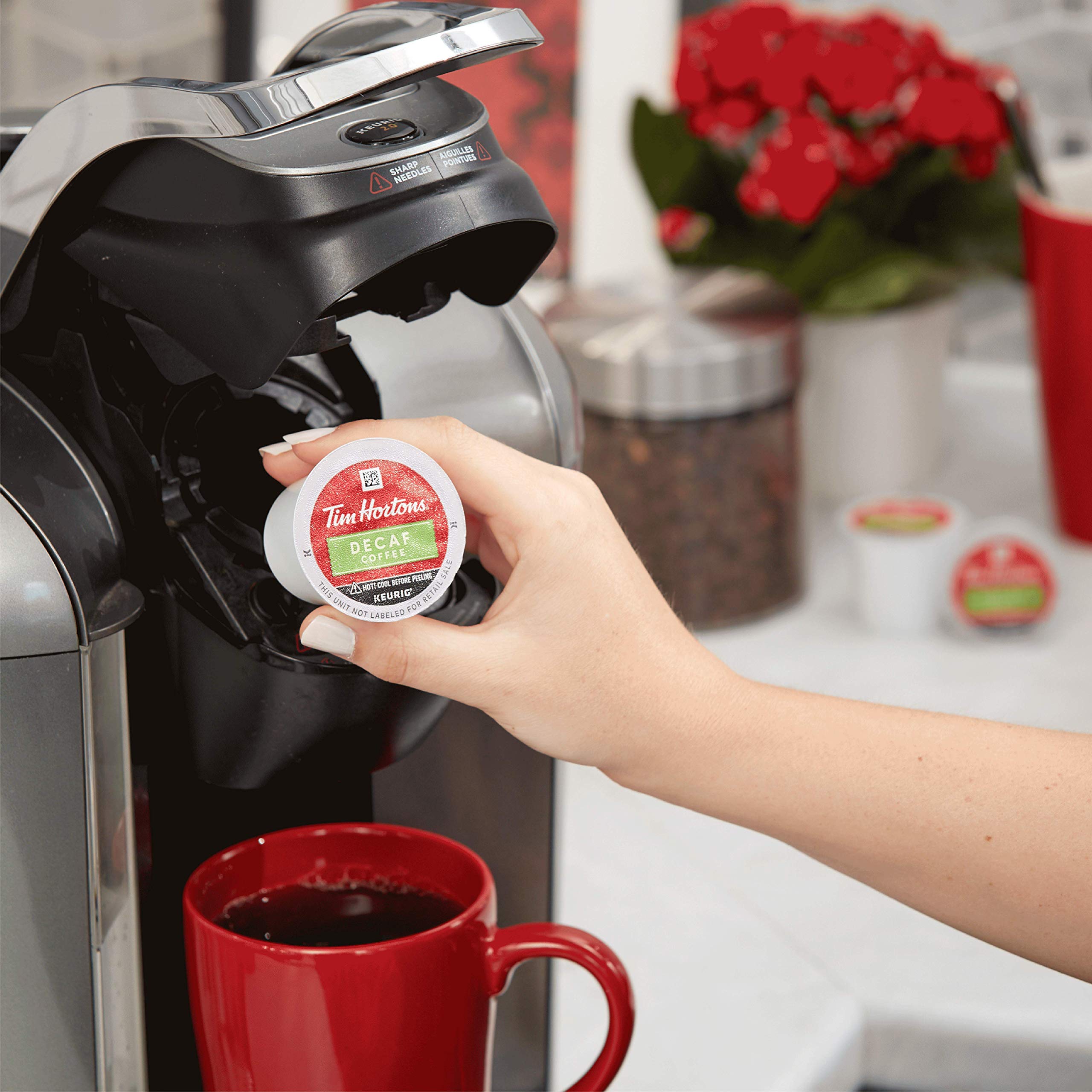 Tim Hortons Arabica beans alongside a K-Cup pod illustrating quality beans