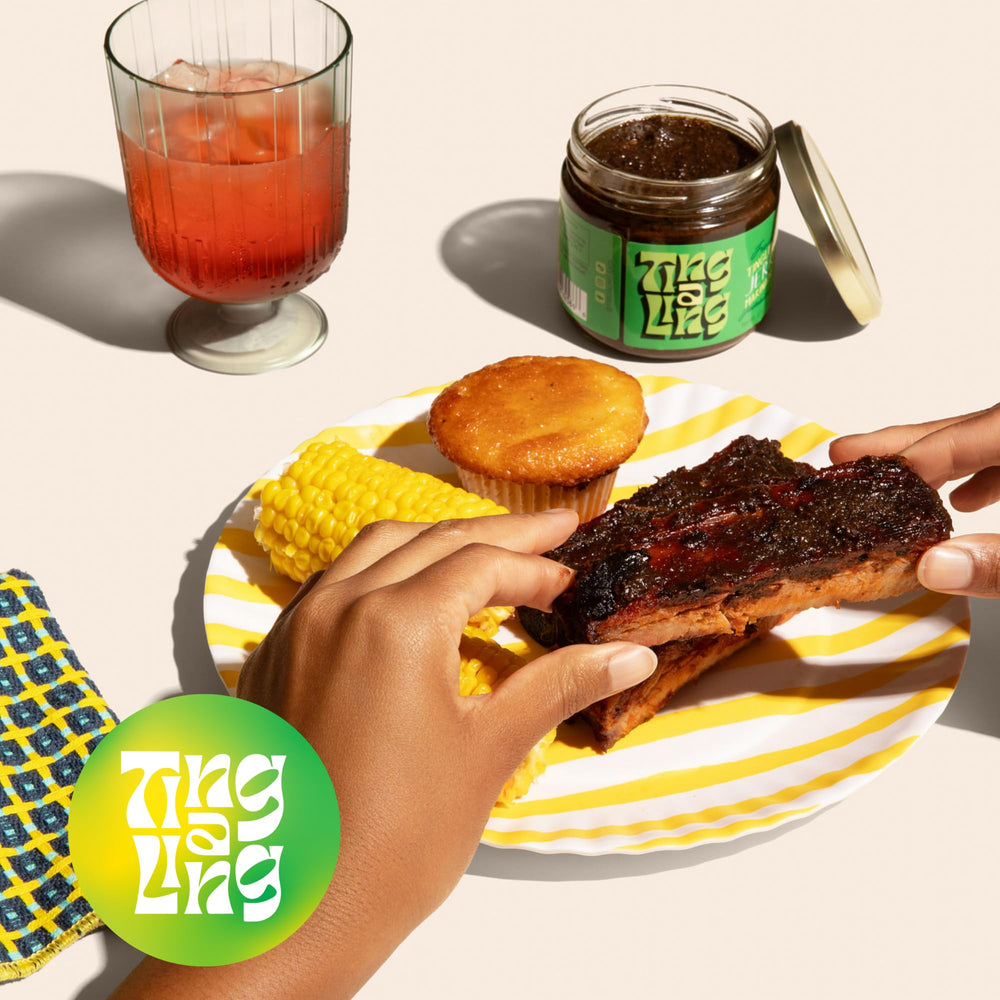 Family enjoying grilled meal seasoned with Ting A Ling in kitchen
