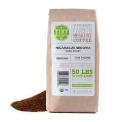 Tiny Footprint Coffee front packaging showing organic dark roast benefits