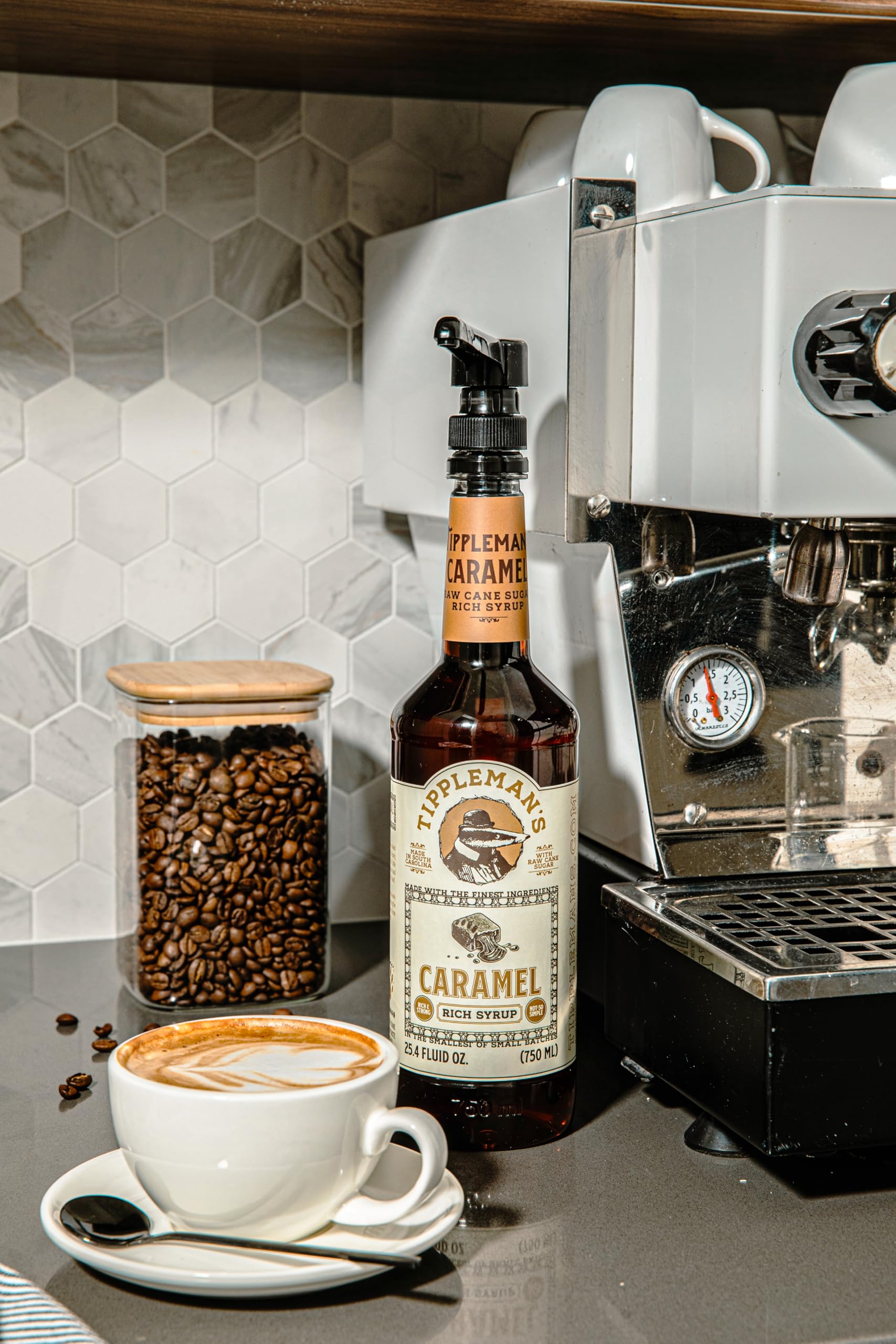 Tippleman's caramel syrup drizzled into iced coffee for flavorful cooling