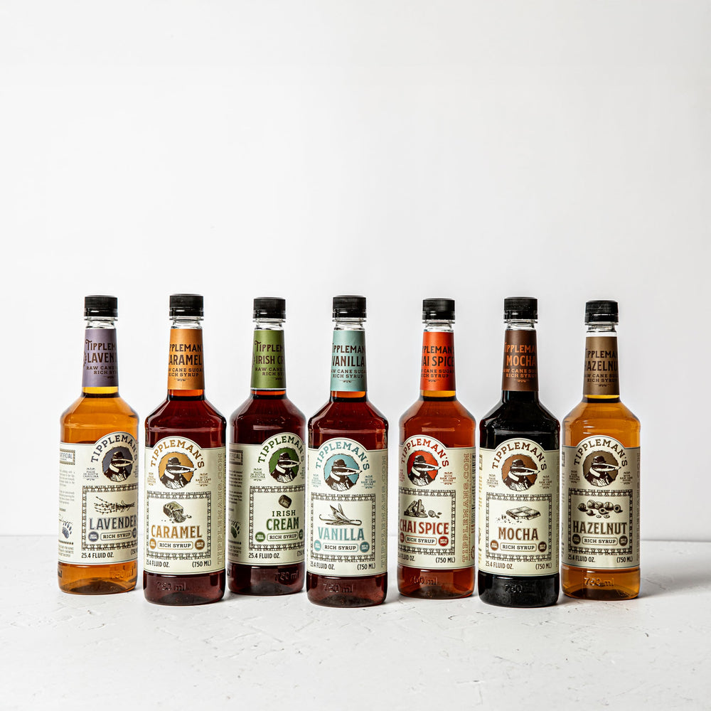Tippleman's caramel syrup stirred through latte showing creamy caramel notes