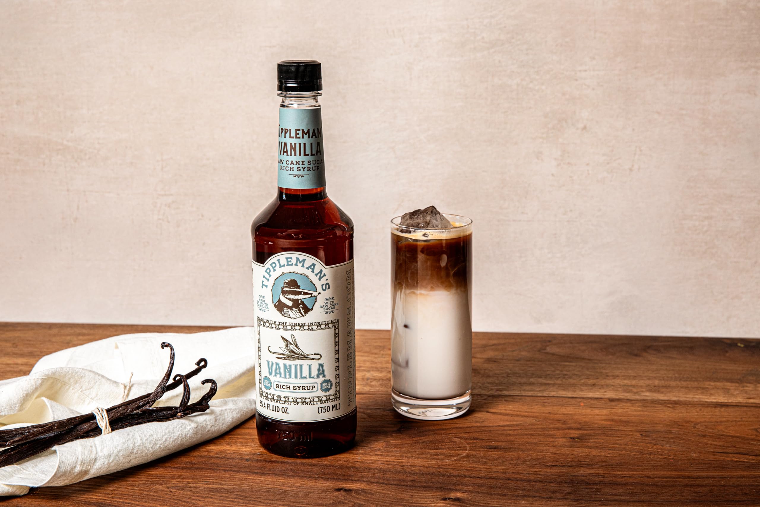 Tippleman's vanilla syrup mixed in iced latte showing cold drink enhancement