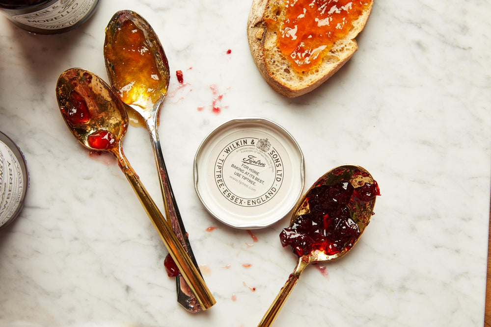 Tiptree conserve on spoon close-up highlighting glossy texture and bright taste appeal