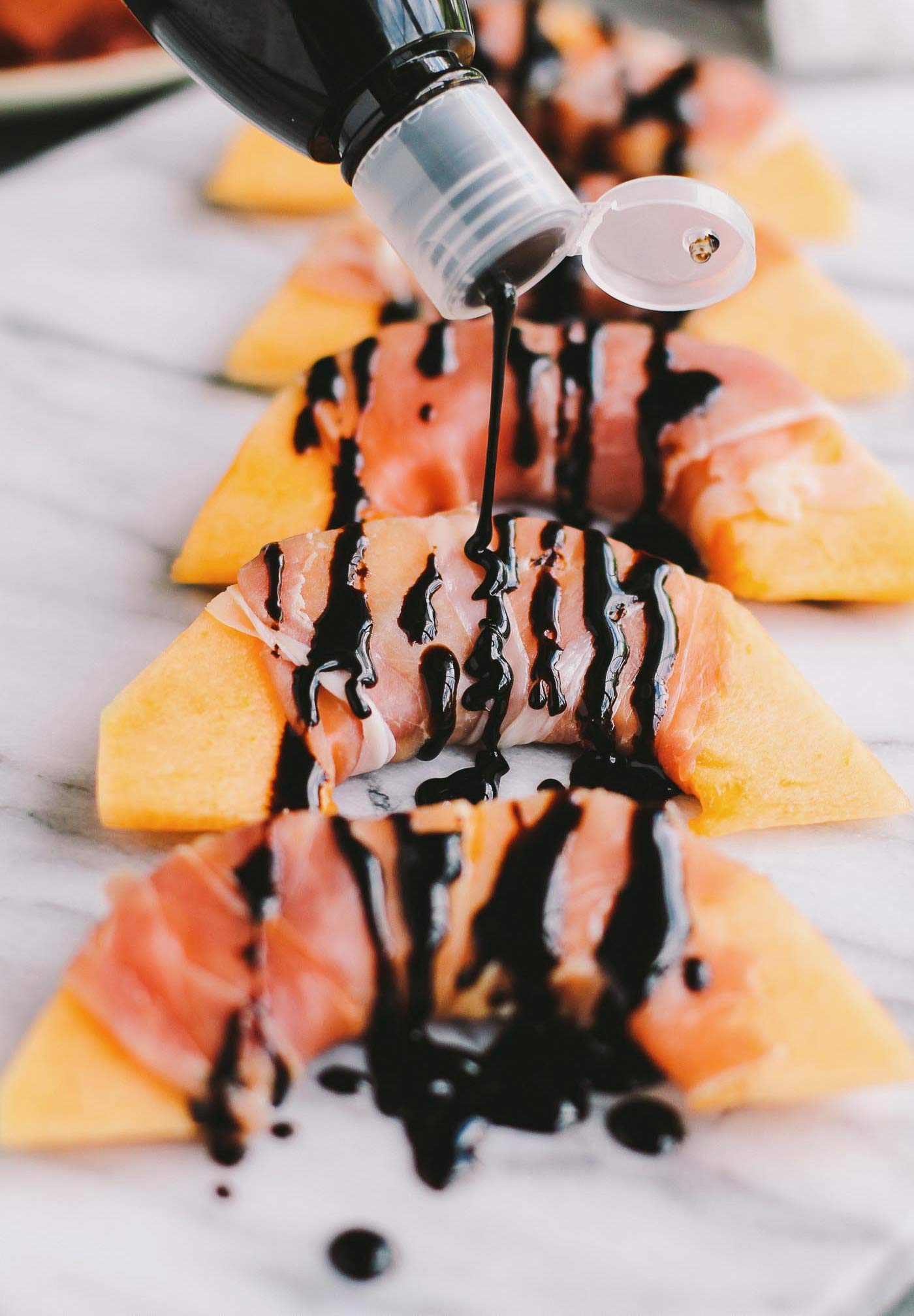 Tondo balsamic glaze pouring close-up showing thick syrup texture and shine