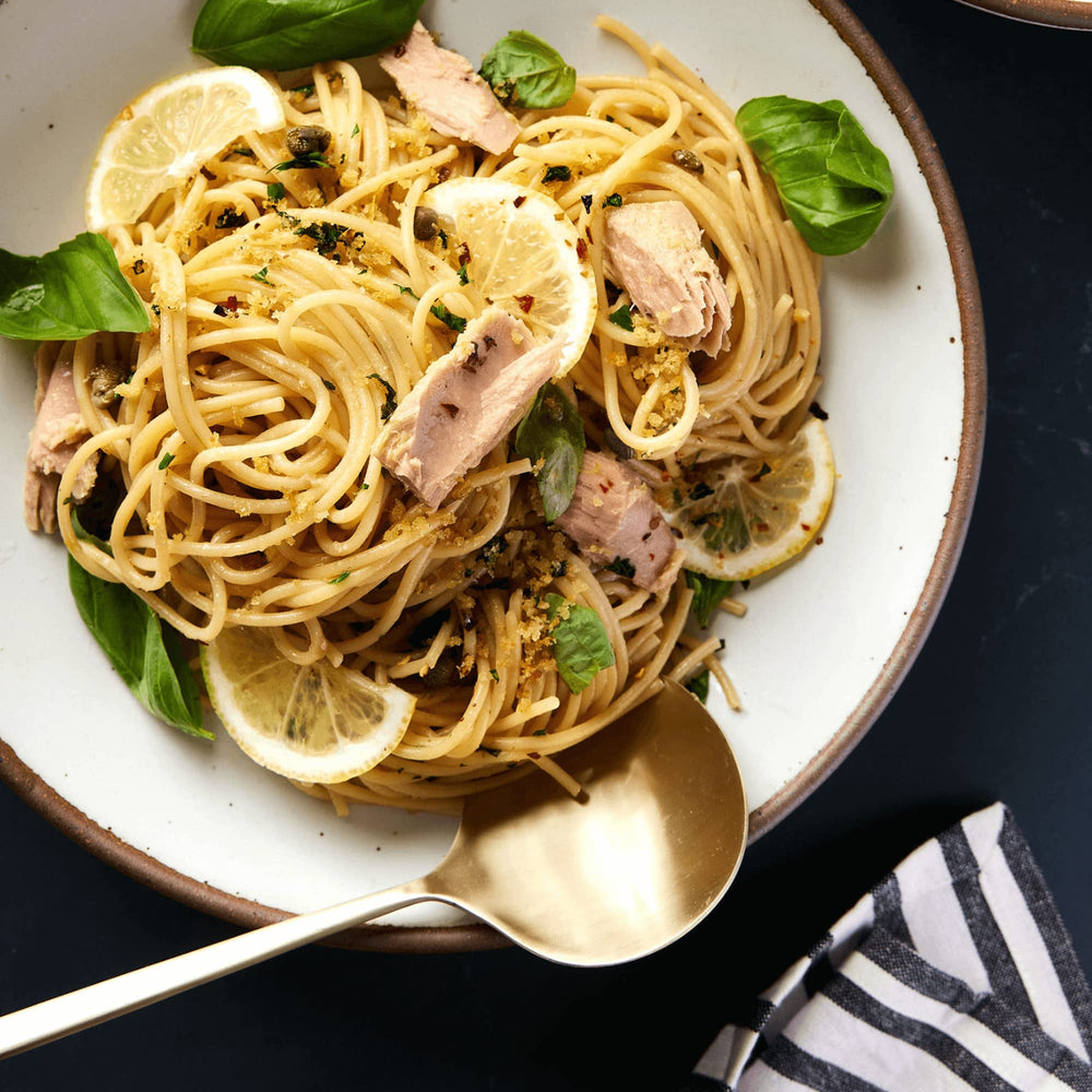 Tonnino jar open with whole fillets visible offering convenience to plate