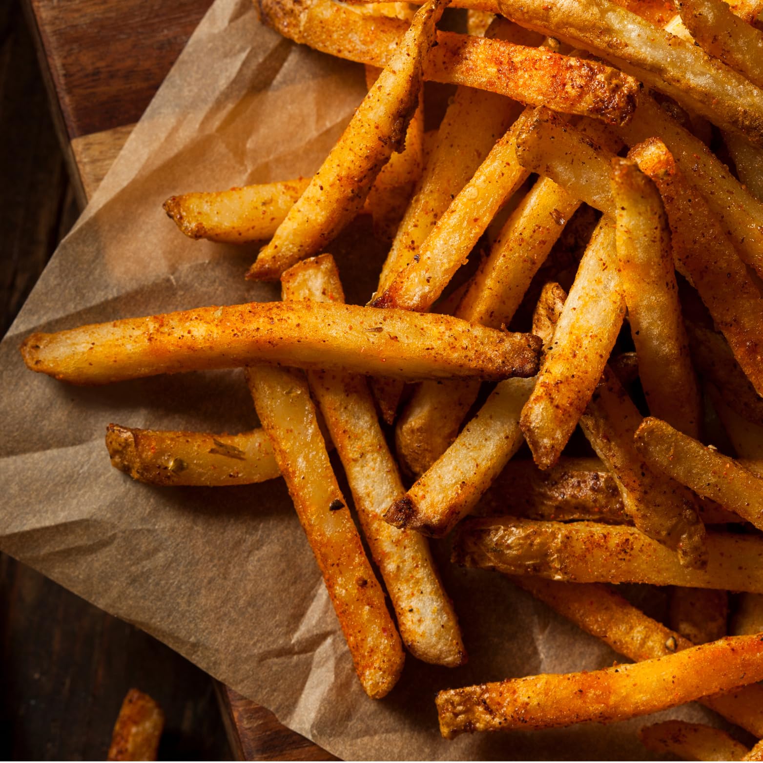 Tony Chachere's seasoned French fries plated for enhanced snack flavor
