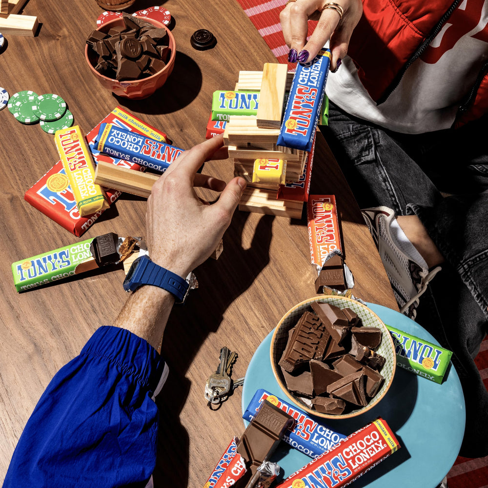 Tony's Chocolonely bar held in hand showing individual size and convenience