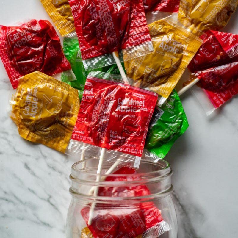 Tootsie caramel apple pops in party bowl showing shareable seasonal treat