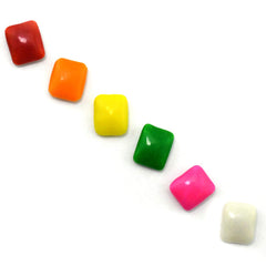 Tootsie Roll Dubble Bubble pieces inside a gumball machine ready for dispensing