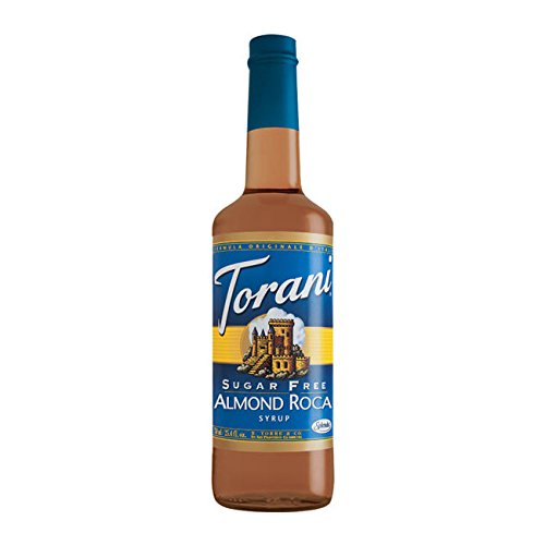 Torani sugar free almond syrup poured into iced coffee highlighting quick dissolve benefit