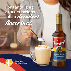 Torani bottle scale next to a coffee cup demonstrating size and capacity advantage
