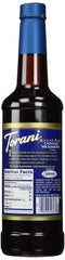Torani syrup poured into latte adding chocolate macadamia flavor for richer drinks