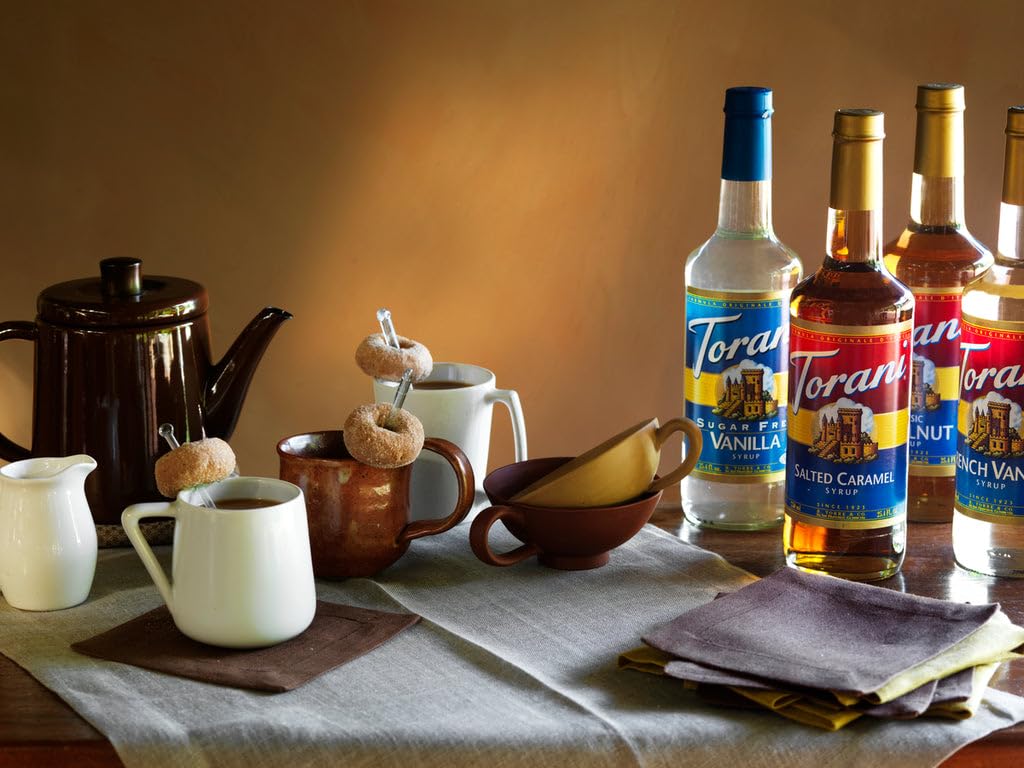 Torani Mojito Mint bottle on a bar counter with tools, conveys professional use