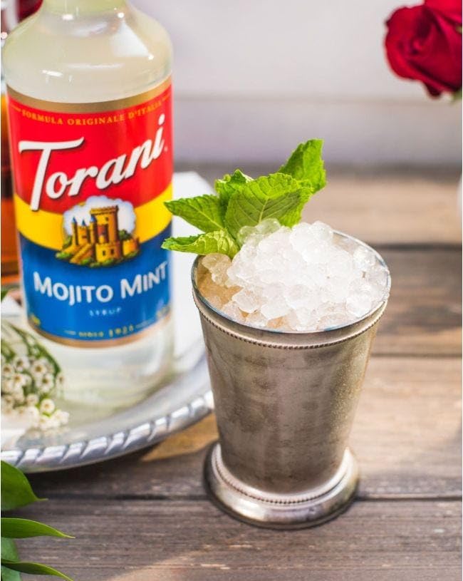 Torani Mojito Mint 750 ml bottle next to a ruler, shows true size and scale