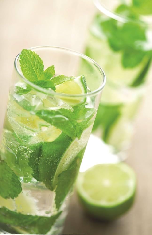 Torani Mojito Mint syrup pouring into glass, demonstrates easy dosing and mixing