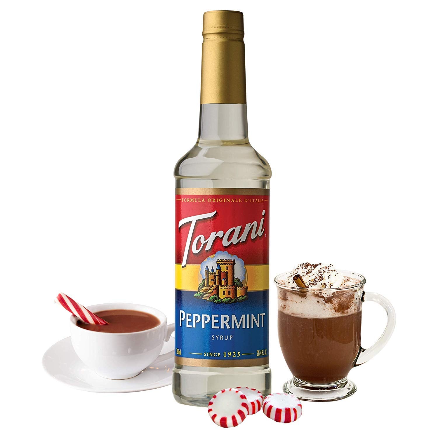 Torani peppermint syrup pouring from bottle into glass highlighting texture and mixability