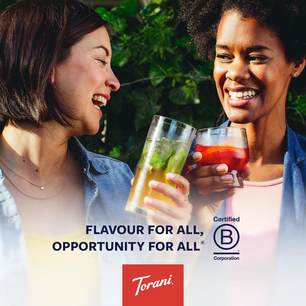 Torani poured into iced latte in hand giving cafe-quality warmth