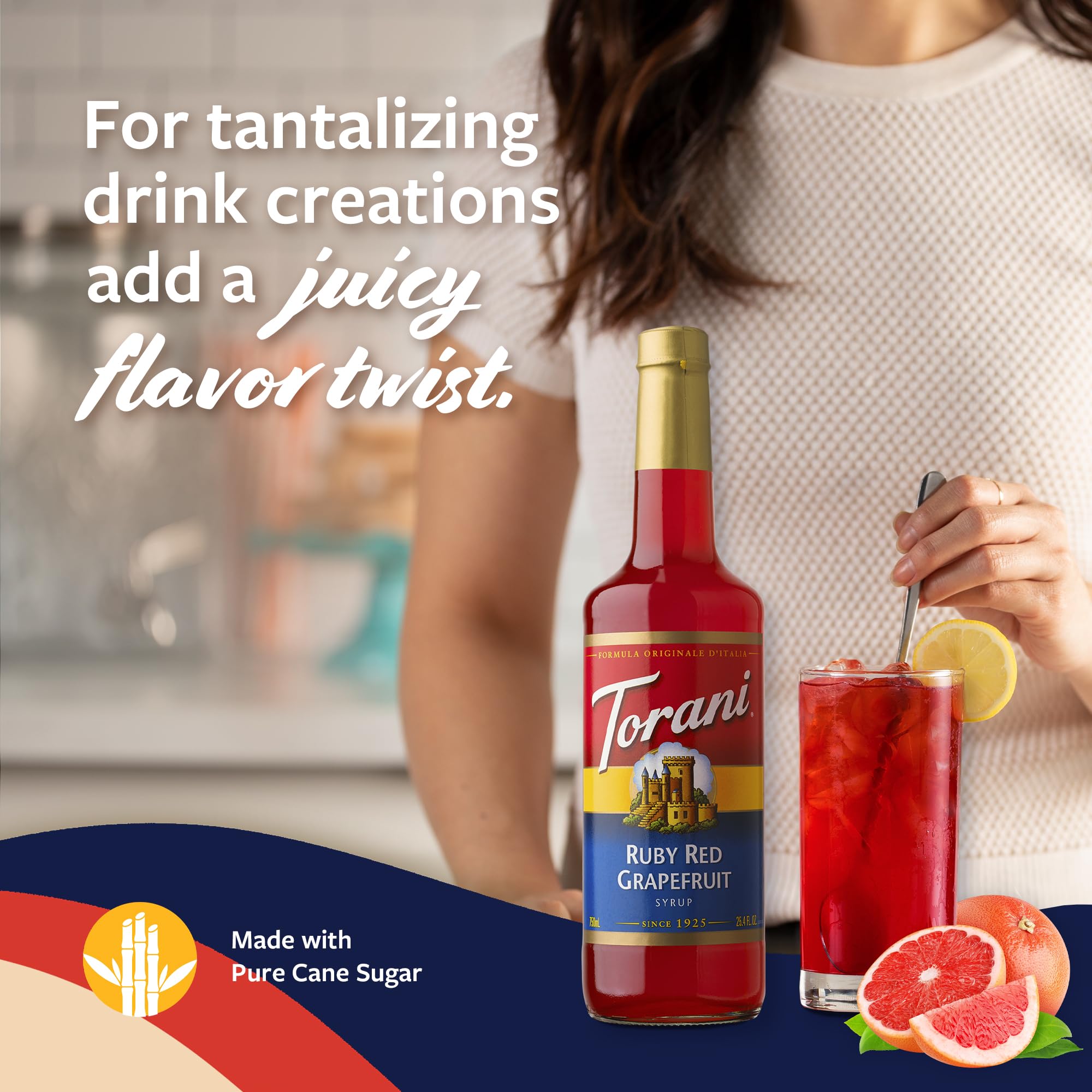 Torani mixed grapefruit cocktail on ice showcasing bright color and refreshment